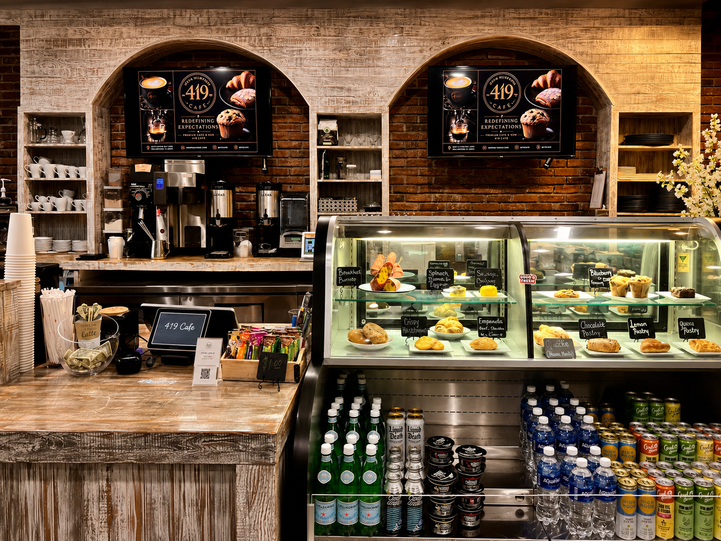 419 Café counter with pastry case, espresso bar, and brick archways